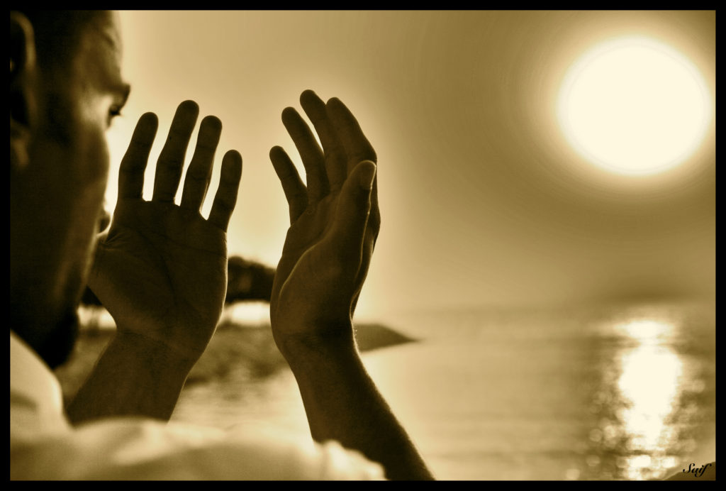 hands lifted up in prayer