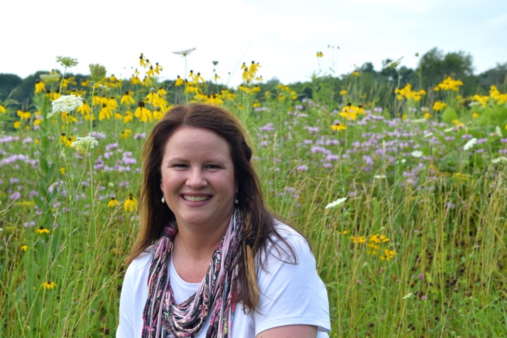 sarah in a field of grass