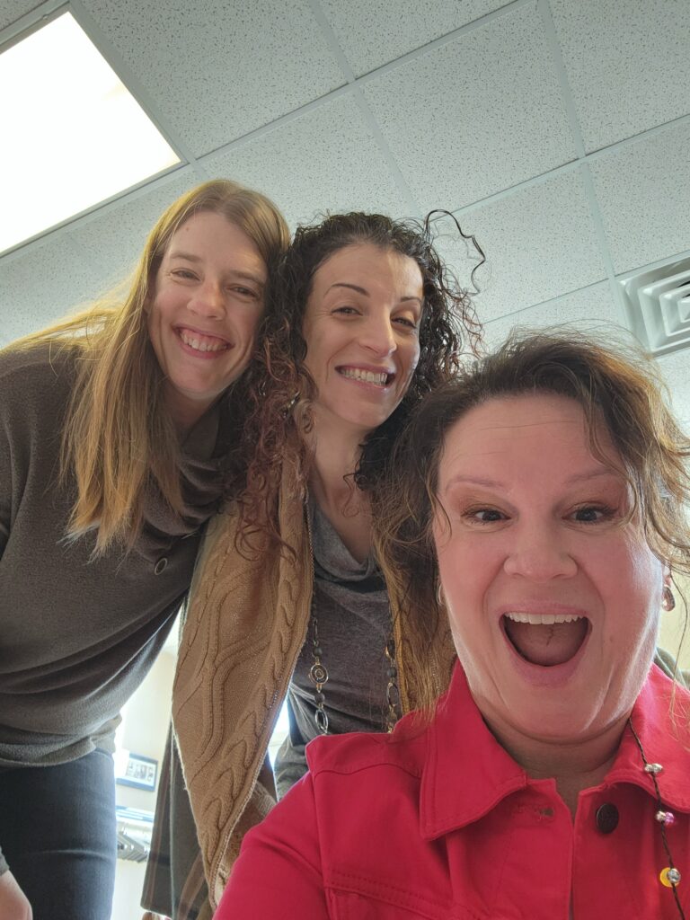 three ladies smiling