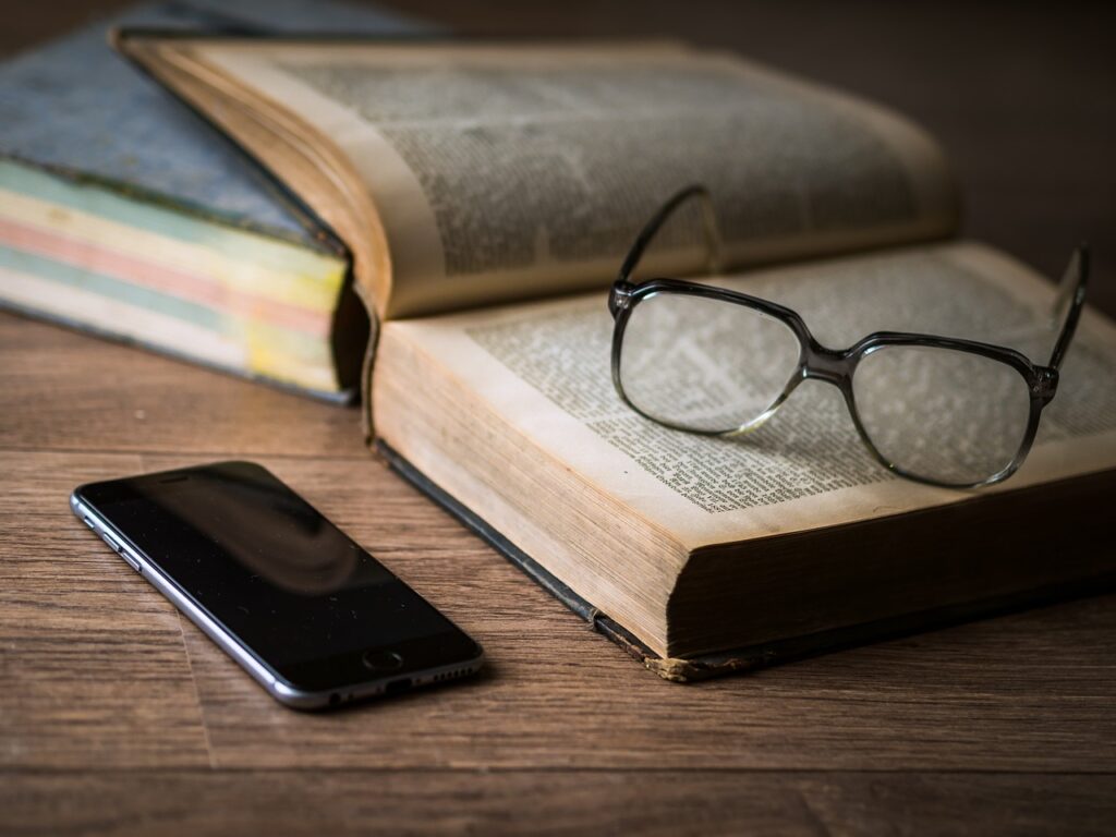 glass bible and phone